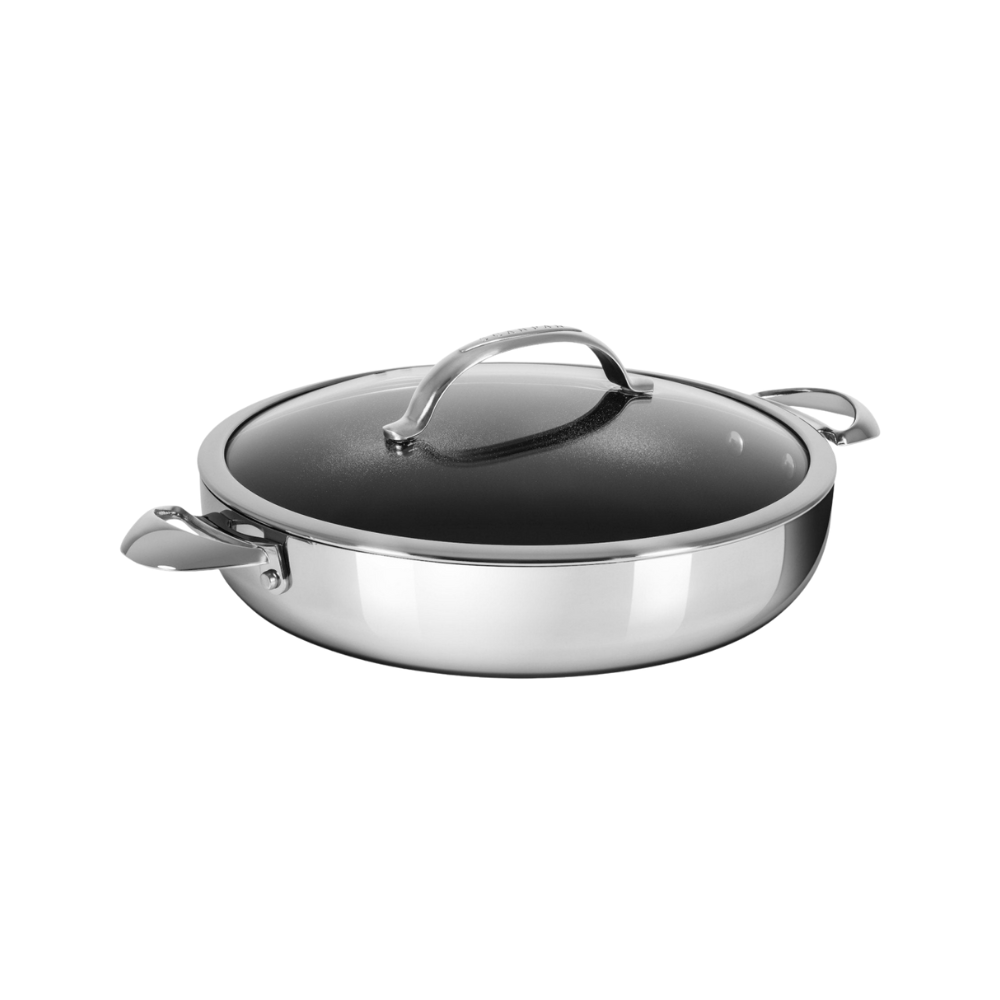 Stainless steel pan with a lid on a white background