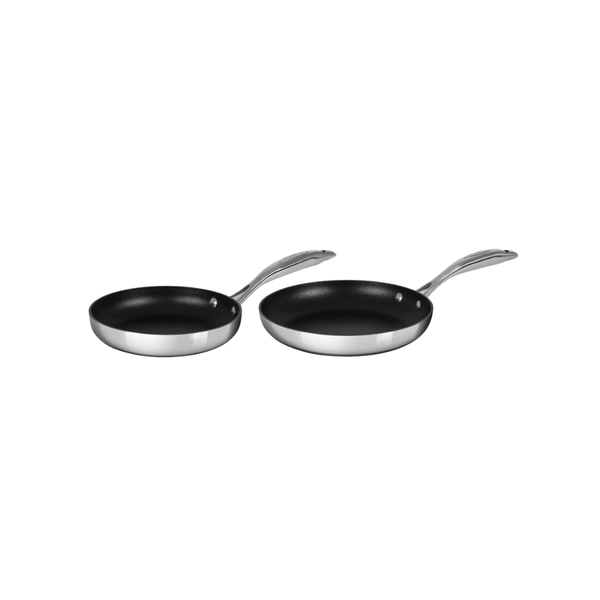 Two black frying pans with silver handles on a white background